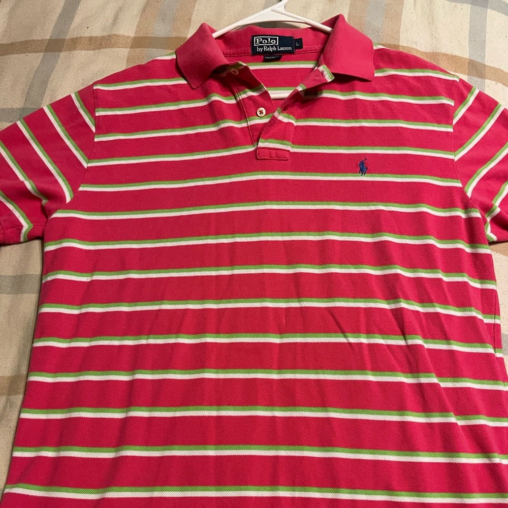 Watermelon pink w/ lime green and white stripes and a blue polo logo. Size L